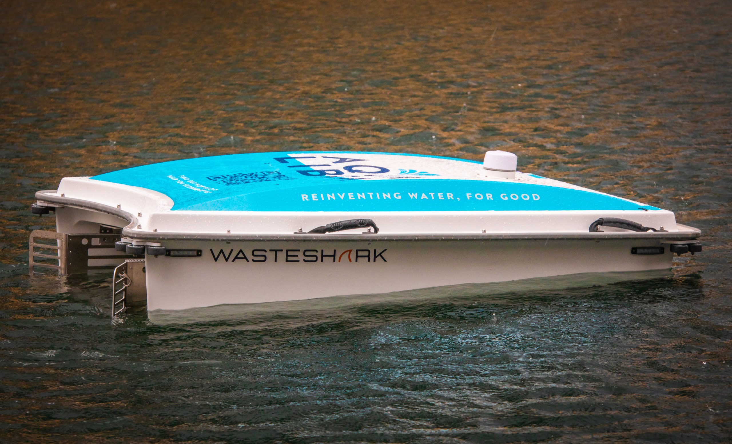 The Aqua Libra Wasteshark, a remote control robot designed to pick up litter on water, in te Middle Dock of Canary Wharf. Canary Wharf, London