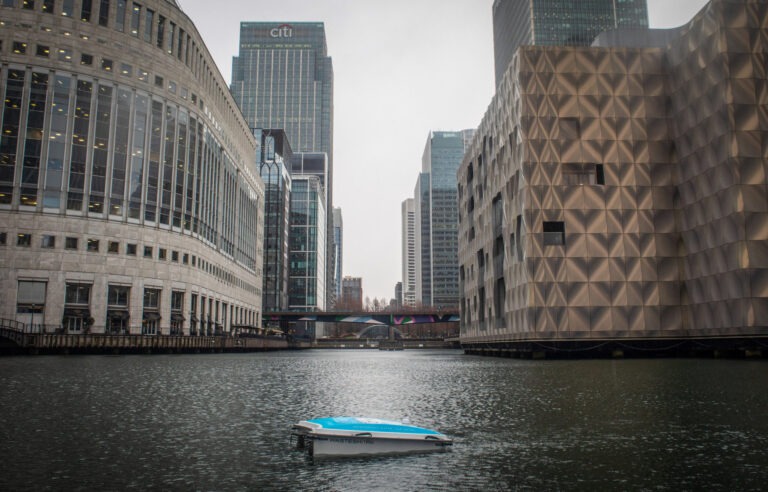 The Aqua Libra Wasteshark, a remote control robot designed to pick up litter on water, in te Middle Dock of Canary Wharf. Canary Wharf, London