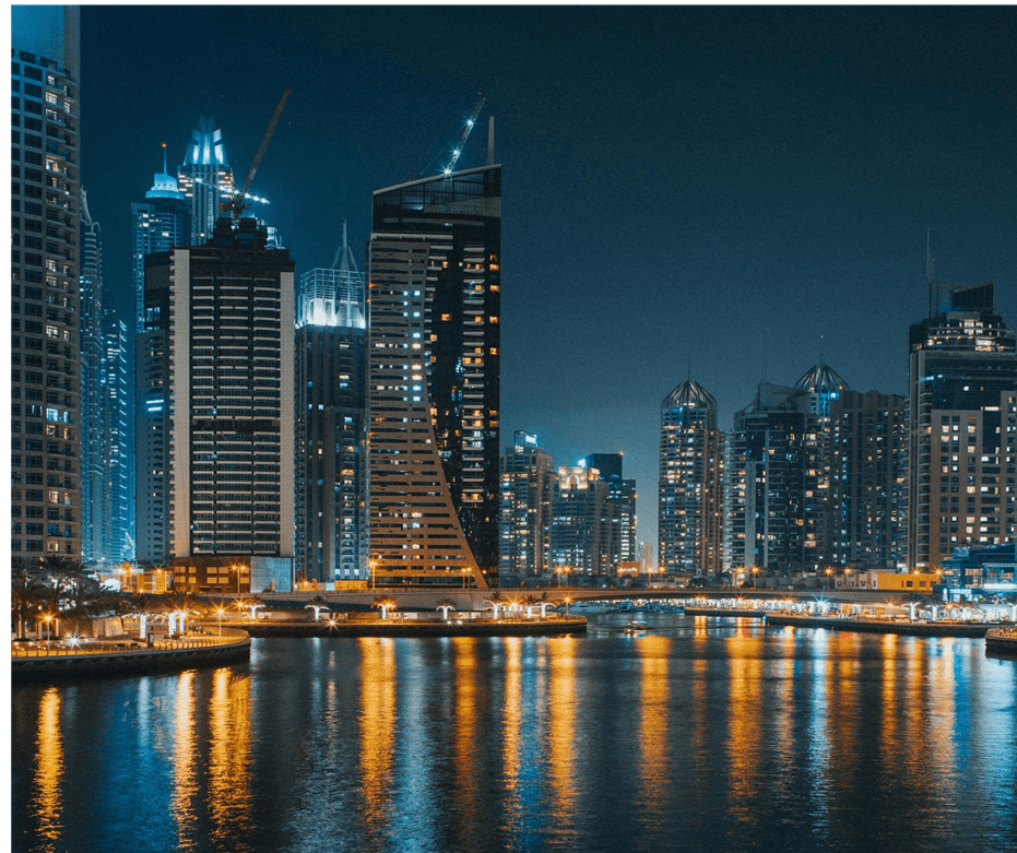Dubai city lights on water at night