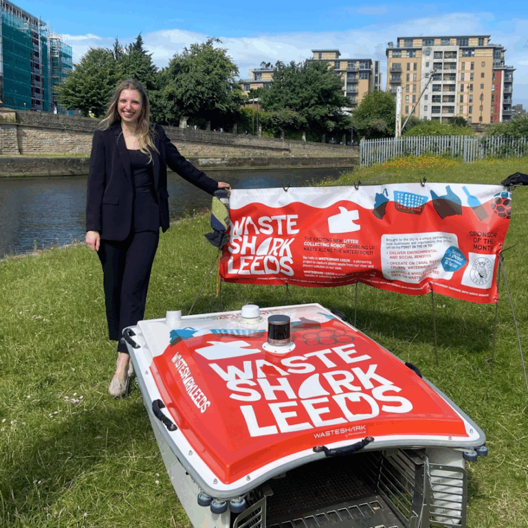 The WasteShark for Leeds, with Leeds livery on it, alongside one of the drivers behind the use of the WasteShark in Leeds.