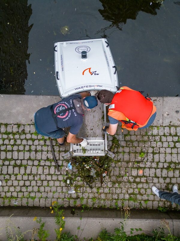 From Observation to Action: The Evolution of Plastic Research 1 PortsToronto staff empty a WasteShark aquadrone of floating debris captured during a Trash Trapping Program